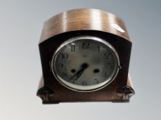 An oak mantel clock.