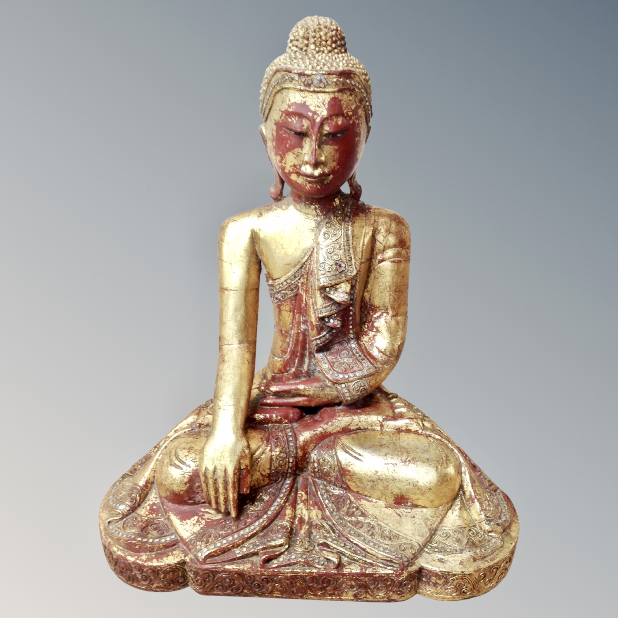 A Thai gilt wood figure of a seated Buddha,