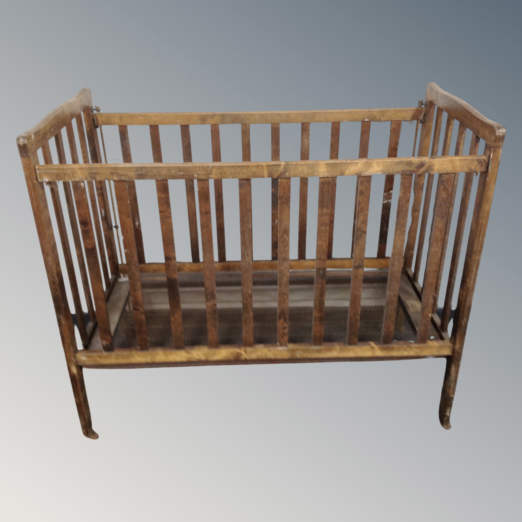 A 20th century beechwood cot