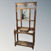 An Edwardian oak mirrored hall stand