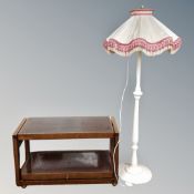 A mid century metamorphic two tier serving trolley together with a painted standard lamp with shade