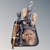 A tray of assorted African carved figures and wall masks together with an Asian two piece carving