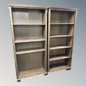 Two sets of contemporary stained pine open shelves