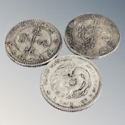 Three Chinese dragon coins