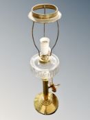 A converted brass oil lamp.