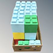 A box of oversized plastic building blocks