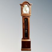 A reproduction longcase clock with brass and silvered dial signed Thomas Byrne,