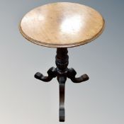 A mahogany and beech circular tripod table