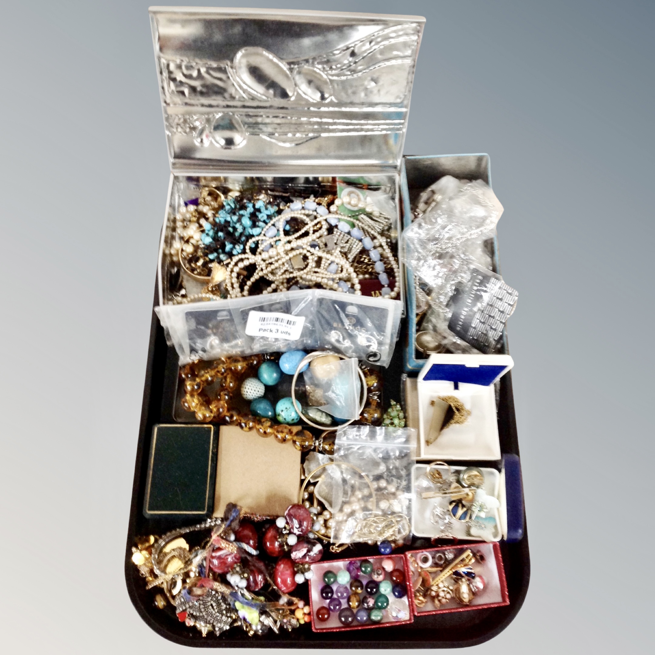 A large quantity of assorted costume jewellery, beads,