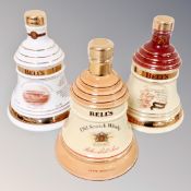 Three Wade Bell's Scotch whisky commemorative decanters : Christmas 1997, 2000, one other,