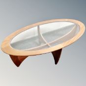 A G-Plan teak oval glass topped coffee table,