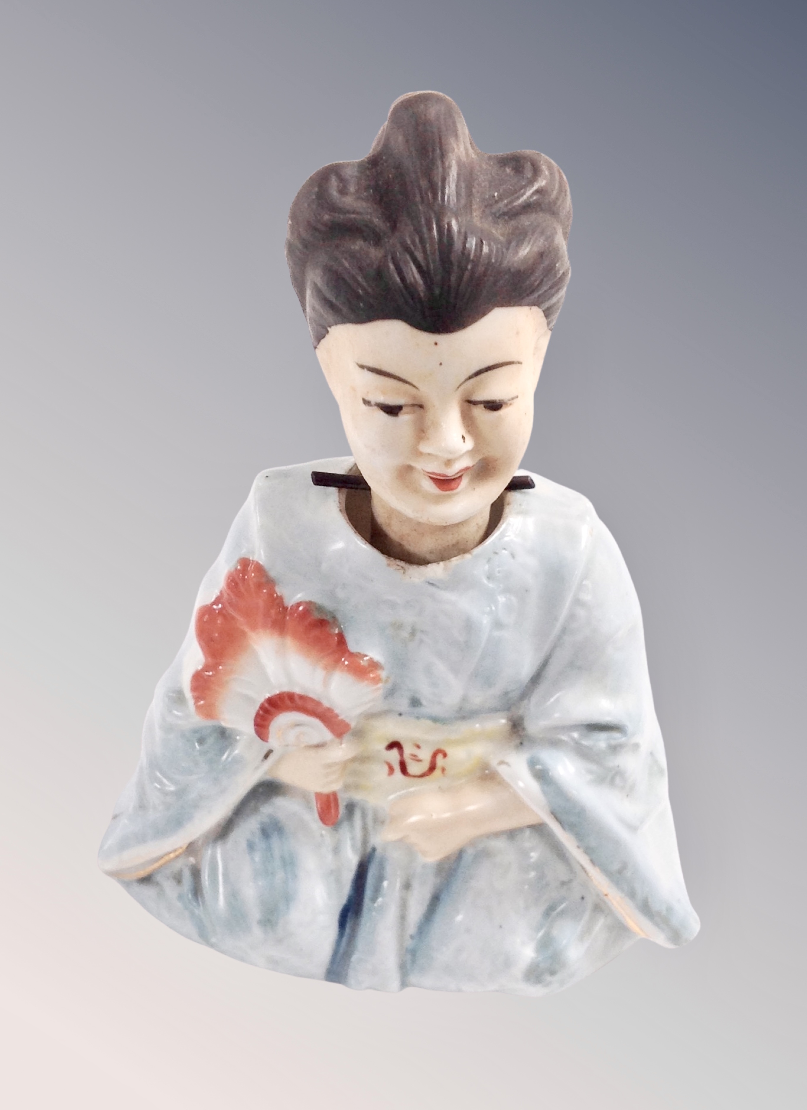 A Japanese nodding head figure of a Geisha