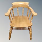 A pair of pine captain's armchairs