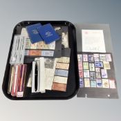 A tray of stamps and transport tickets on card, cased pens with include Parker,