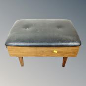 A mid 20th century sewing box/stool and contents