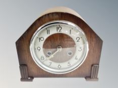 An Art Deco oak eight day mantel clock.