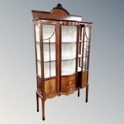 A Victorian inlaid mahogany bow fronted glazed display cabinet,