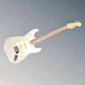 A Squier Strat by Fender guitar in carry bag