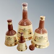 Four graduated Wade Bells Whisky decanters,