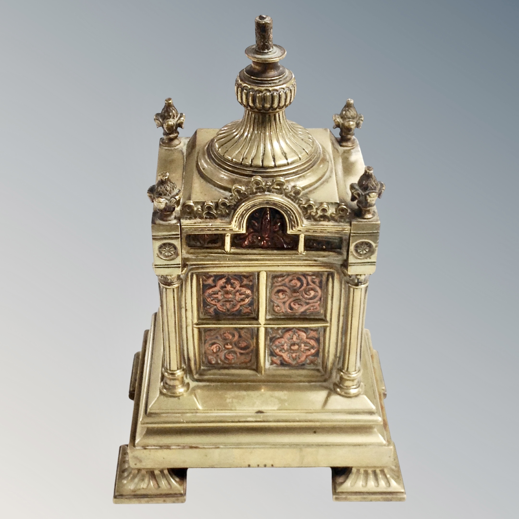 An ornate Victorian brass mantel piece garniture,