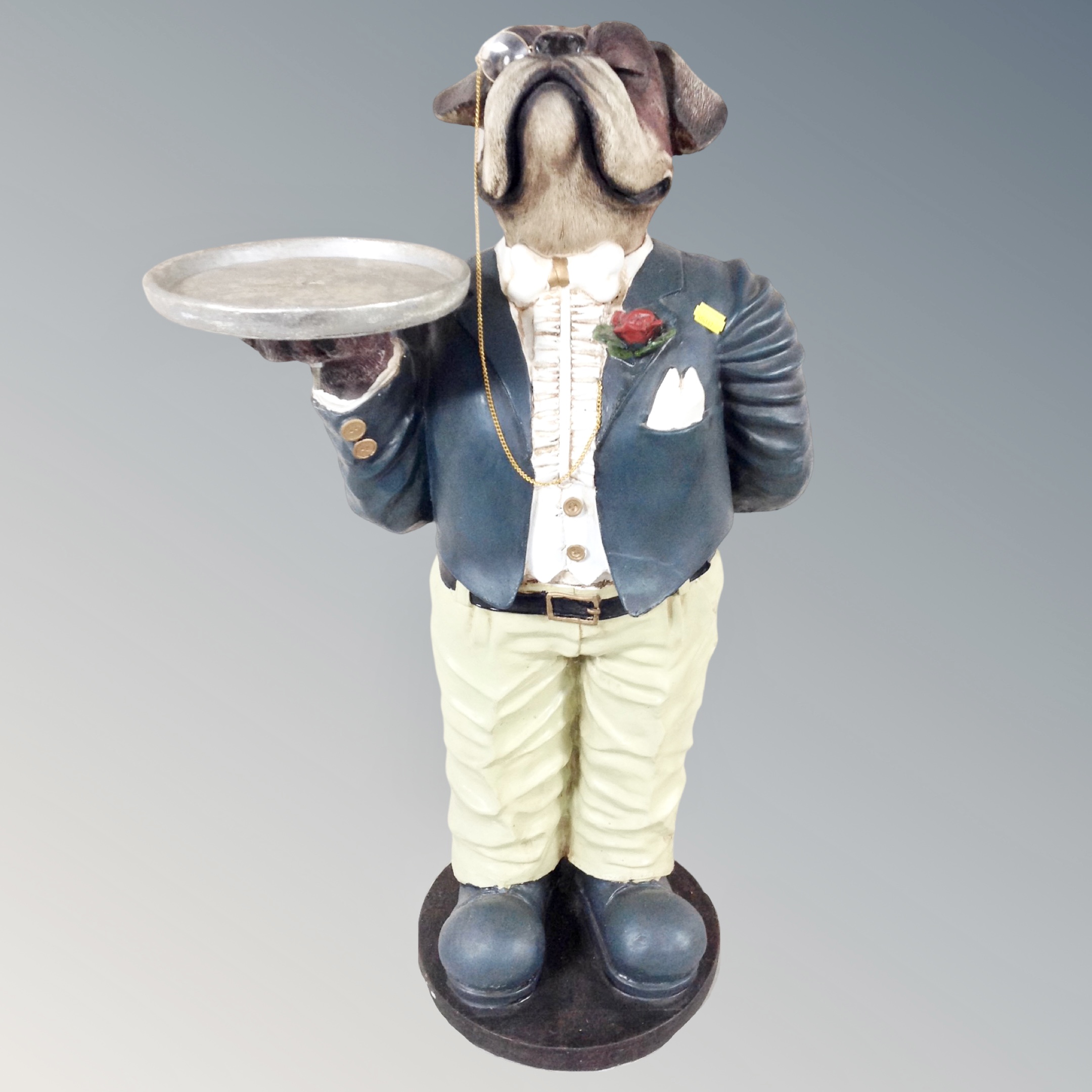 A figural dumb waiter in the fomr of a bull dog with tray,