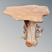 A contemporary tree trunk table,
