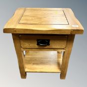 A contemporary solid oak lamp table fitted a drawer width 50 cm