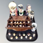 A group of Staffordshire figural thimbles, thimble stand in the form of a house,