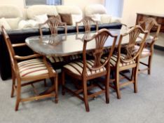 A reproduction twin pedestal dining table together with a set of six chairs CONDITION