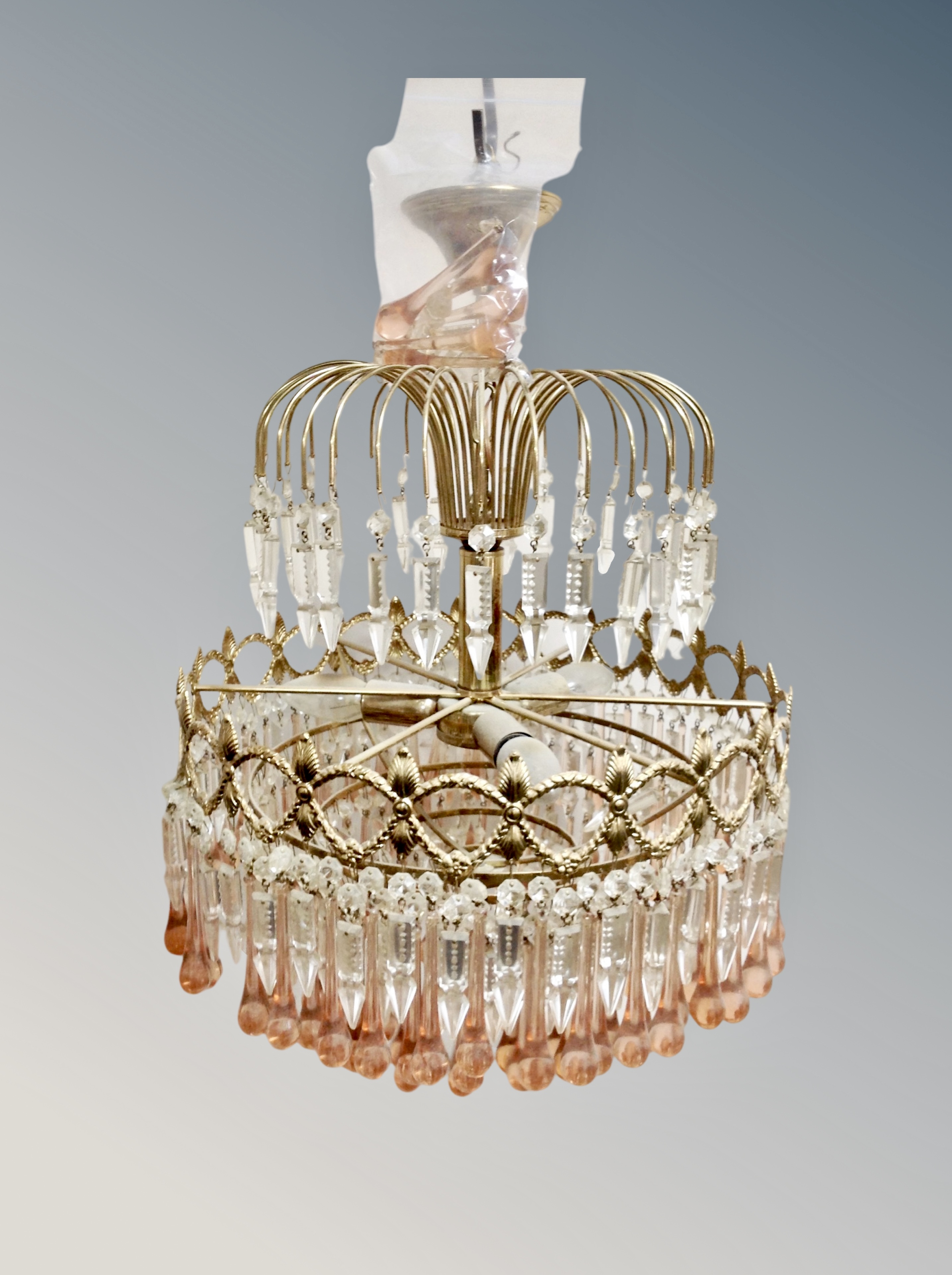 A continental gilt metal and two tone crystal pendant light fitting, wired for electricity,