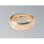 A 9ct gold band ring, size V CONDITION REPORT: 4.