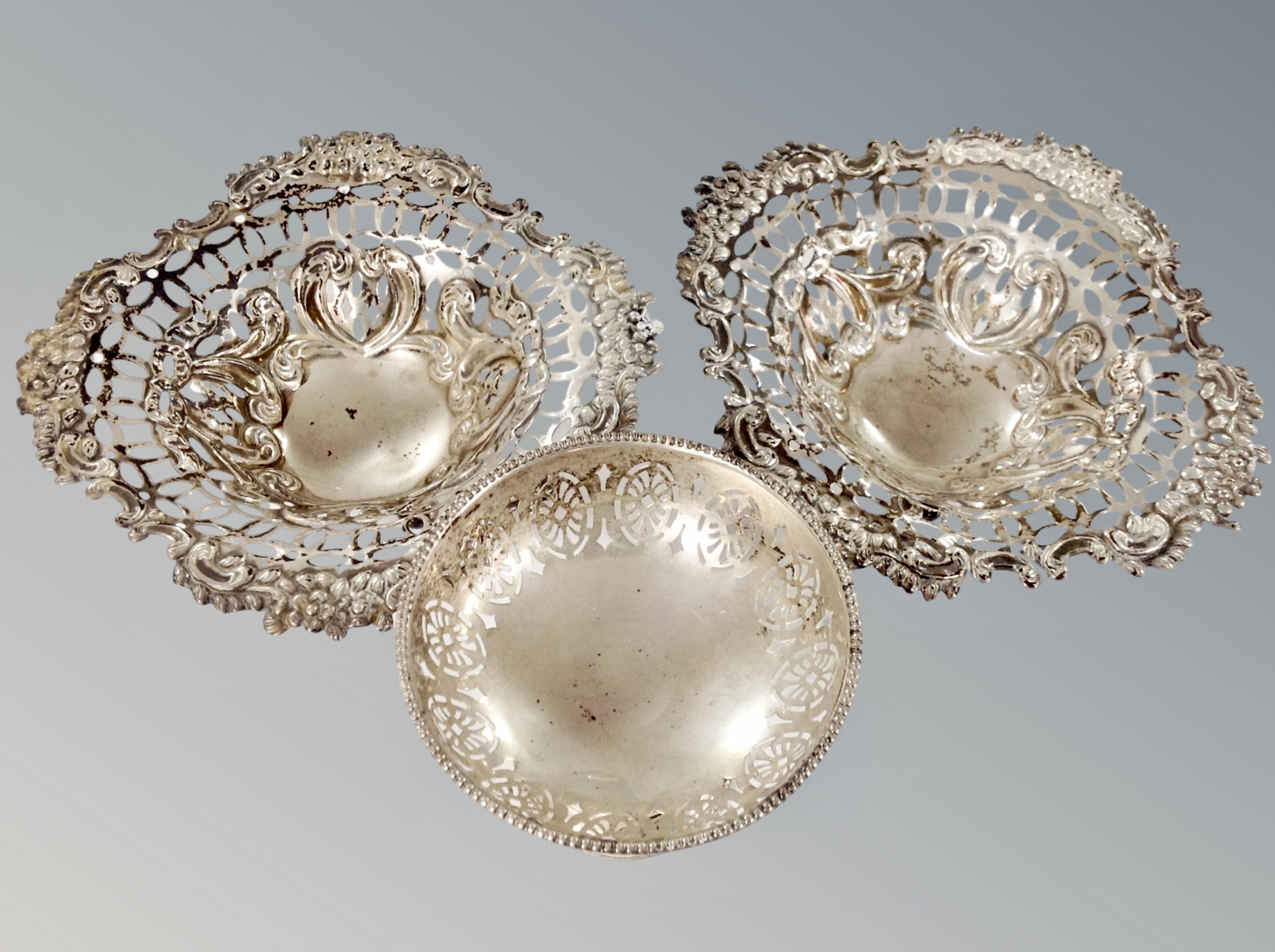 A pair of pierced silver bonbon dishes,