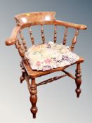 A vintage elm smoker's chair