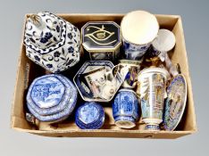 A box containing Ringtons commemorative caddies, a blue and white urn with cover, further pottery.