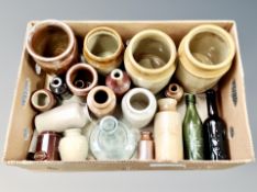 A box of stone ware vessels, vintage glass bottles,