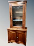 A Continental mahogany glazed cabinet on stand,