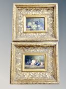 A pair of still life over painted prints 16 cm x 11 cm, in heavy gilded frames.