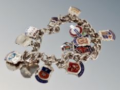 A silver bracelet with crests