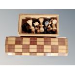 A boxwood chess set in box, kings 6cm,