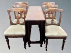 An antique mahogany drop leaf table together with six Edwardian chairs