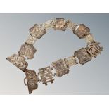 A Chinese silver belt, composed of sixteen panels decorated with flora and fauna,