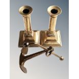 A brass desk ornament of a ship's anchor,