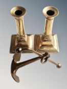 A brass desk ornament of a ship's anchor,