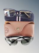 A pair of Ray Ban sunglasses in stitched leather case and pair of Tommy Hilfiger glasses in case