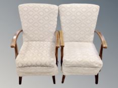 A pair of mid century beech framed armchairs with 54 cm