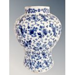 A 19th century Islamic blue and white earthenware vase,