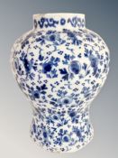 A 19th century Islamic blue and white earthenware vase,
