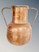 A copper twin-handled vessel,