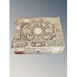 A 19th century Chinese export heavily carved mother of pearl gaming box,