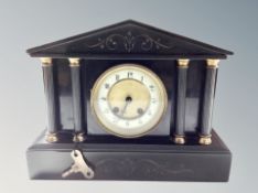 A black slate eight day mantel clock,